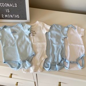 NWOT Set of 4 newborn onesie
